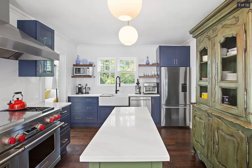 Chief's kitchen with elite appliances incl 48" Wolf range, grill, and griddle