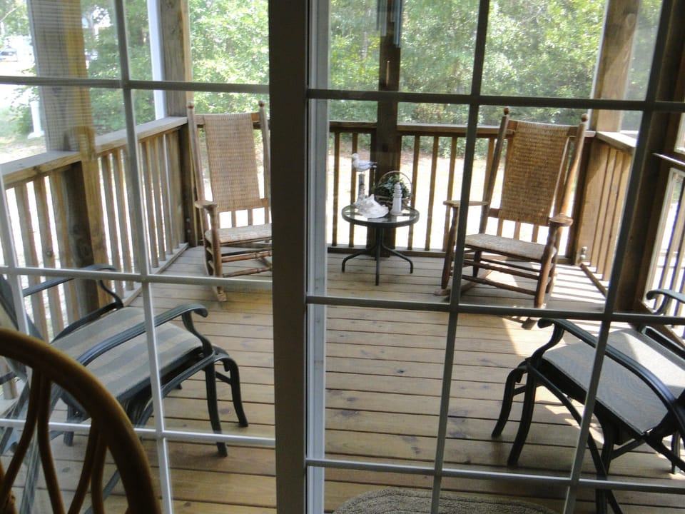 Relax and unwind on the screened in back porch.