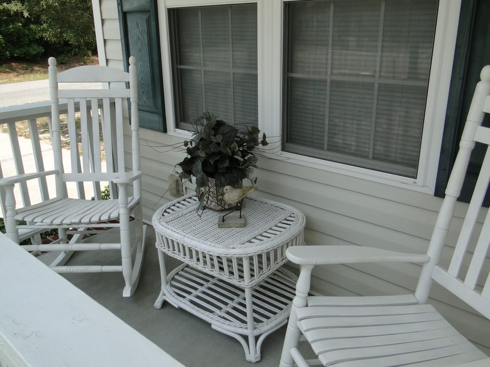 Relax and listen to the beach on the front porch rockers.