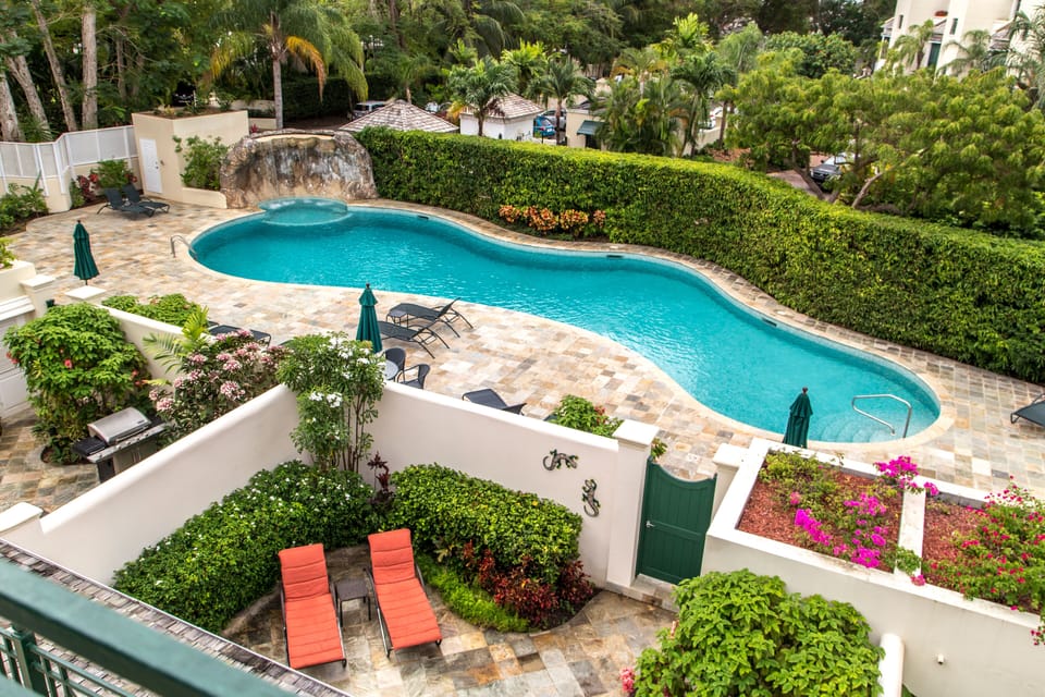 Large pool with waterfall right outside the back door