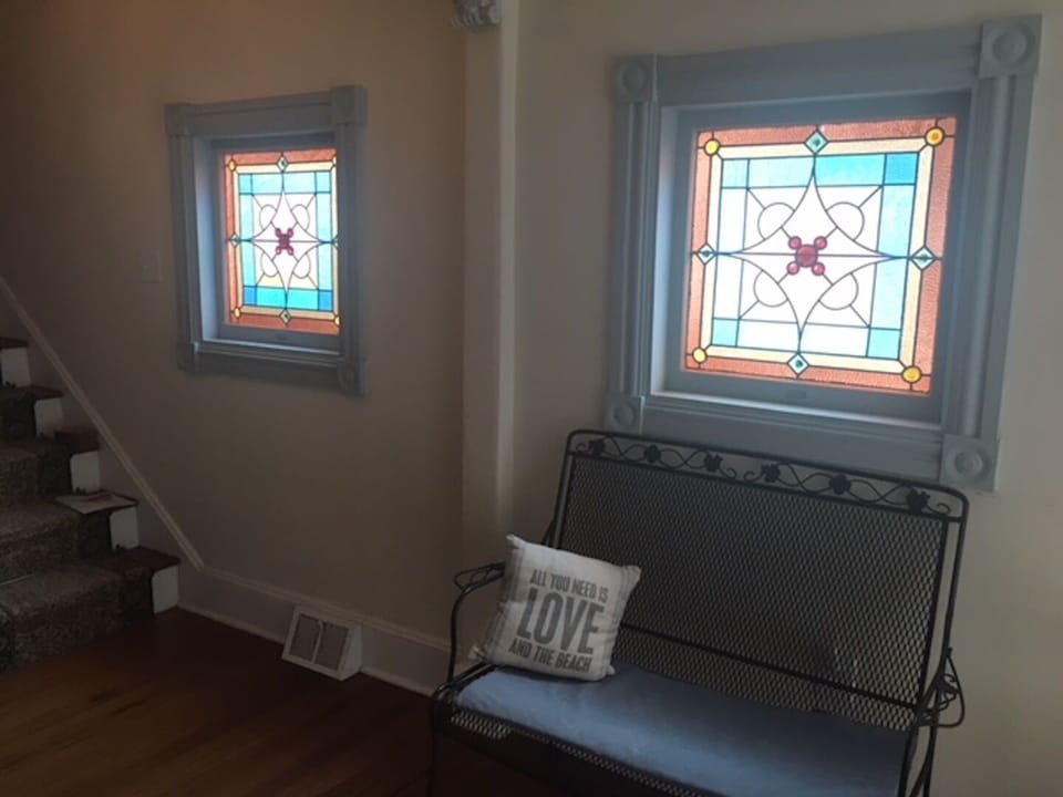 Beautiful stained glass windows in front hallway. 