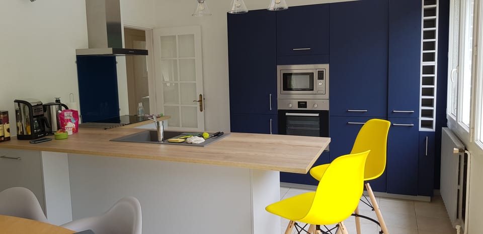 Kitchen has integrated dishwasher, oven, hob and microwave and is open plan.