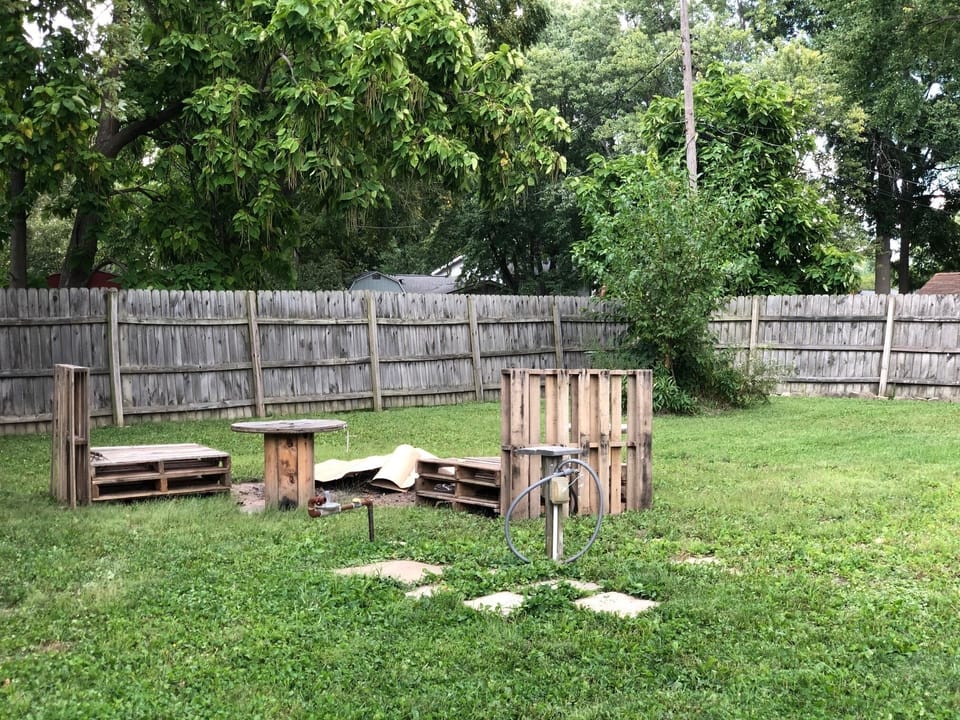 Fire Pit area in completely fenced in back yard.