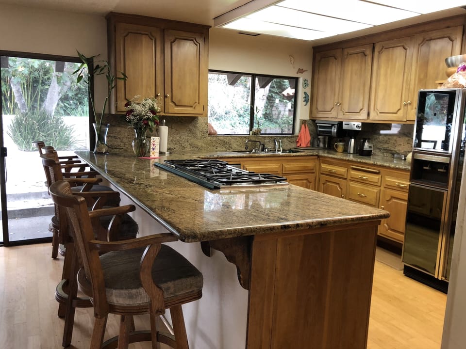 granite counters, cherry wood cabinets and pecan hardwood floors