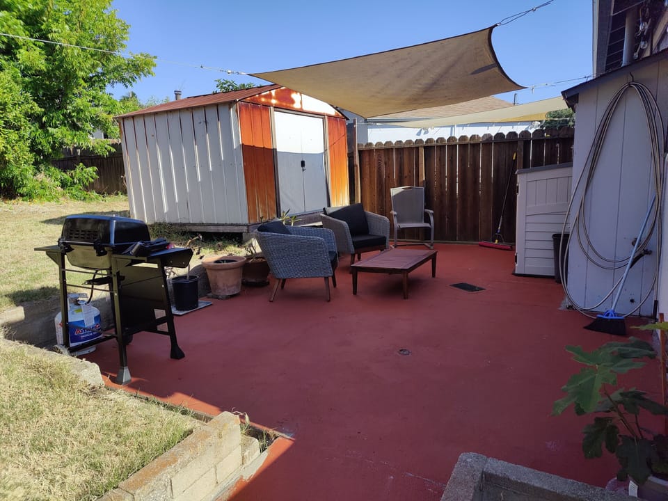 backyard patio with grill, private laundry, storage unit, container garden 