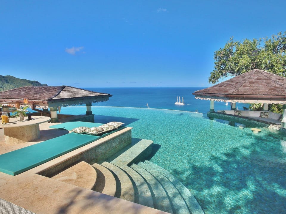 The Infinity Pool has natural stone pebbles and is heated for all year round use