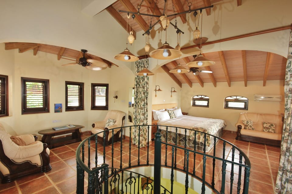 The Penthouse Suite has a huge bed and an adjoining open plan living area