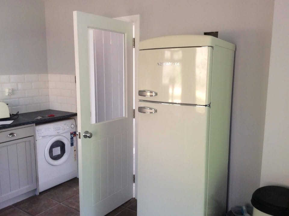 the kitchen area has contemporary and stylish appliances 