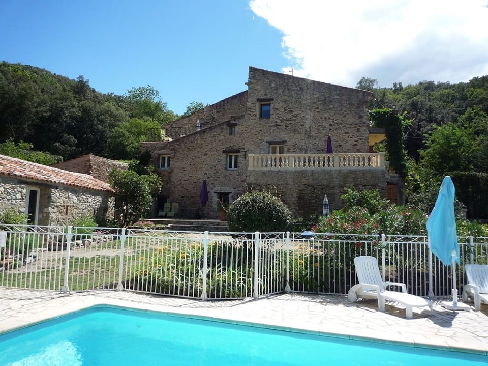 View of farmhouse from pool