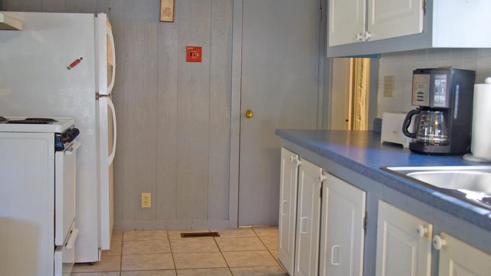 Full size range, refrigerator, coffee maker and microwave included.