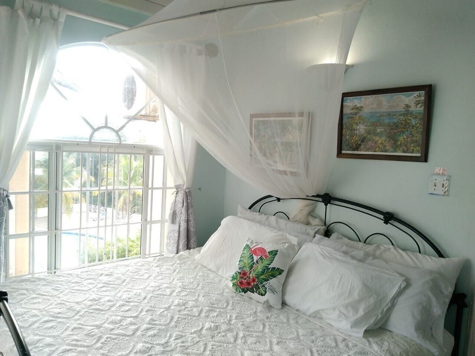 Light filled studio with view of pool