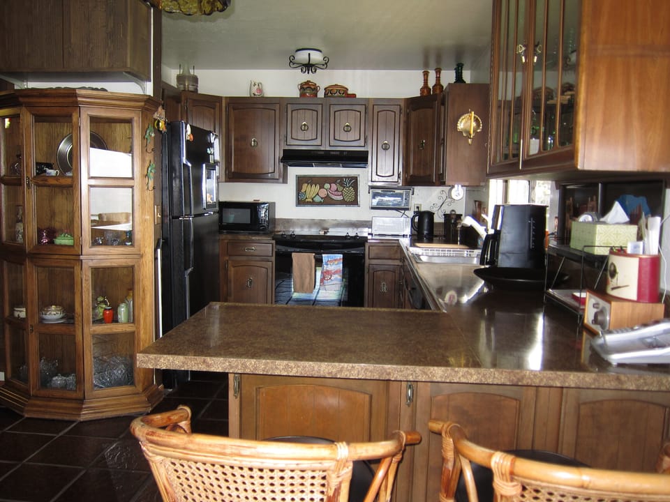 A fully stocked kitchen, with a window overlooking the water as well!
