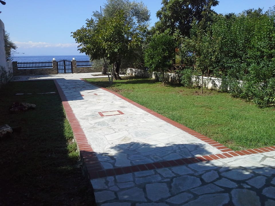 Stoned pathway leading to private sunning area and Kalifteri Beach
