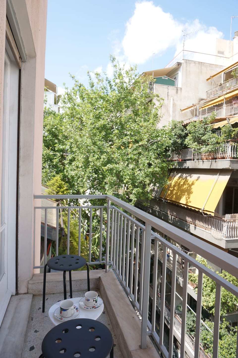 Teeny balcony where you can watch the neighborhood go about its business