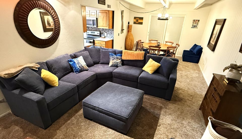 Comfy Living room with gas fire place and plenty of seating.