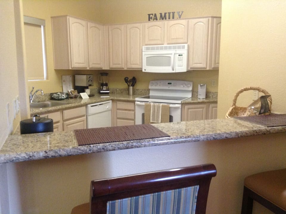 Fully-equipped kitchen with all appliances,  granite counters and breakfast bar