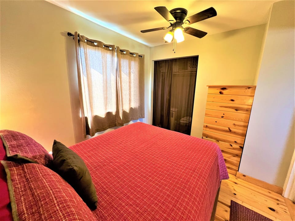 Queen bedroom with AC unit