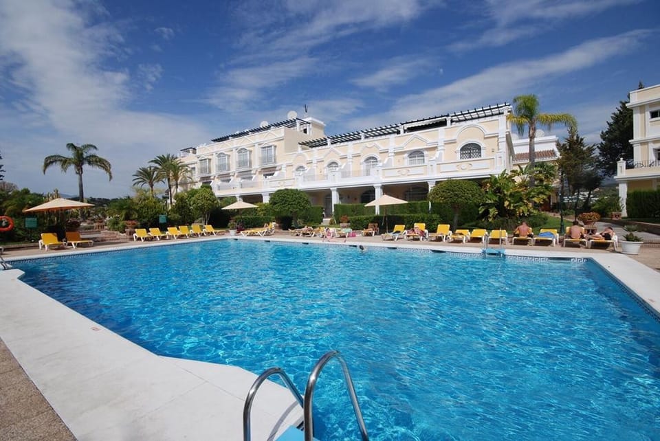 Pool with sunbeds