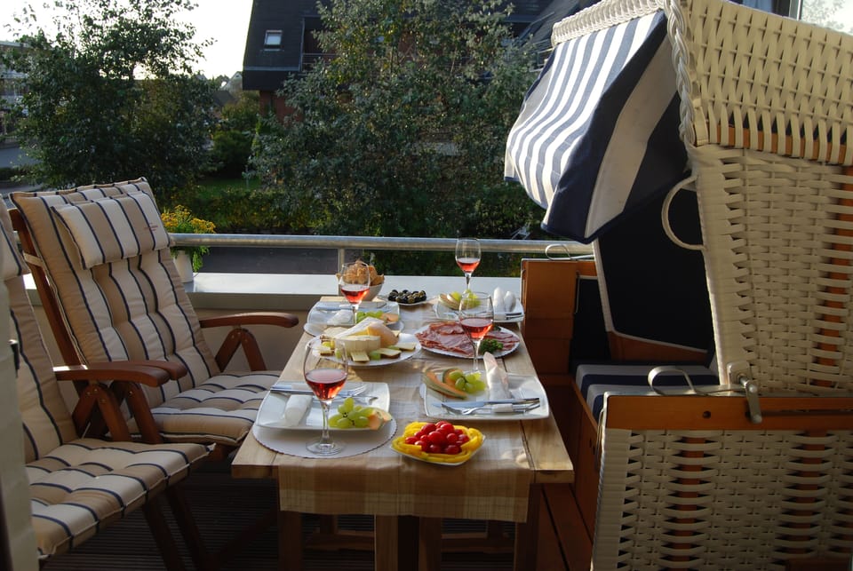 Sunny southwest balcony with beach baskets and beautiful view of the village pon