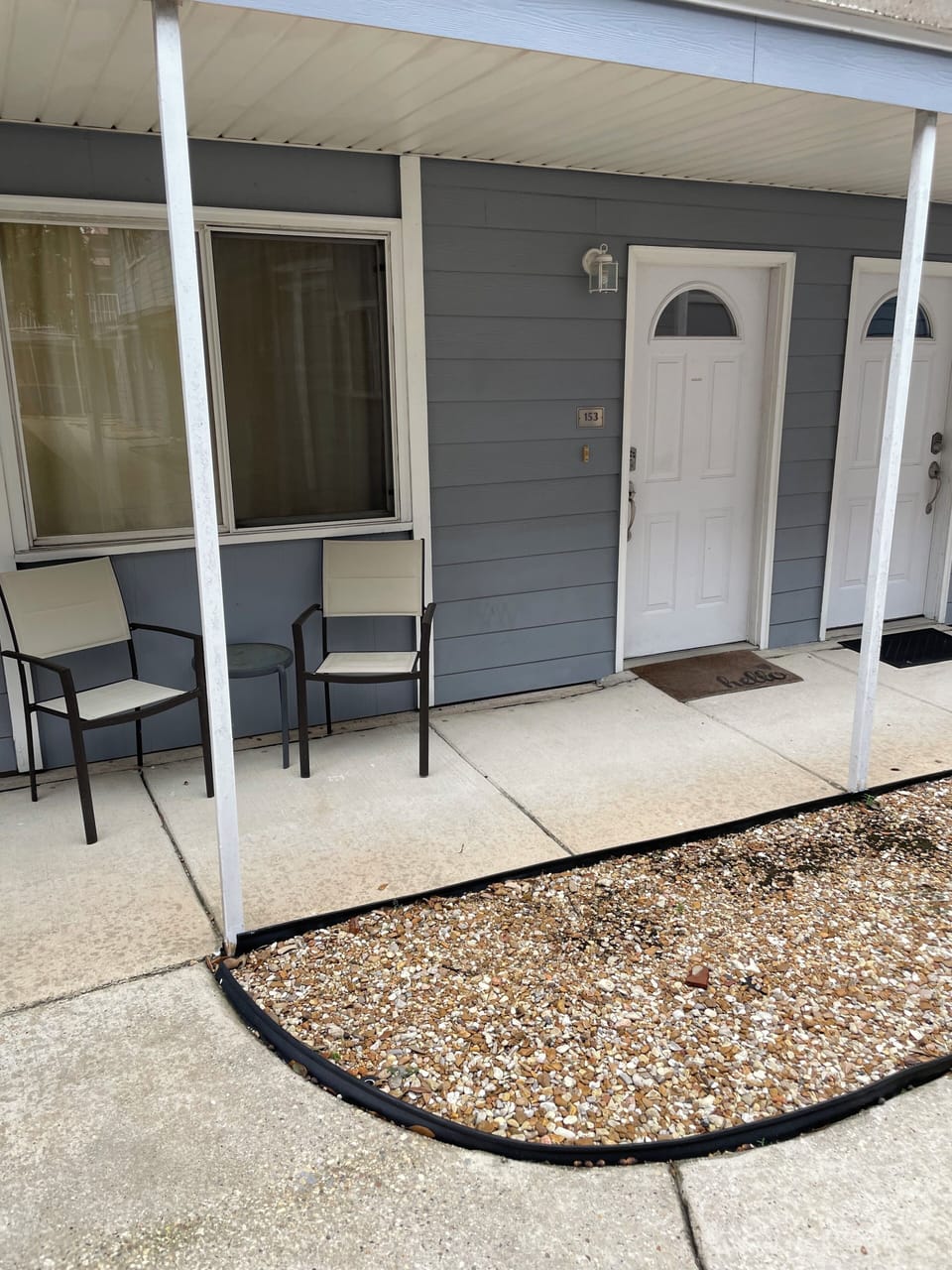 Front view of property with sitting chairs.
