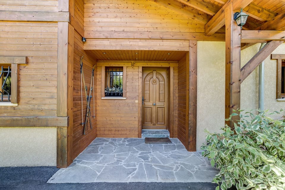 Traditional chalet exterior with chic, rustic interior