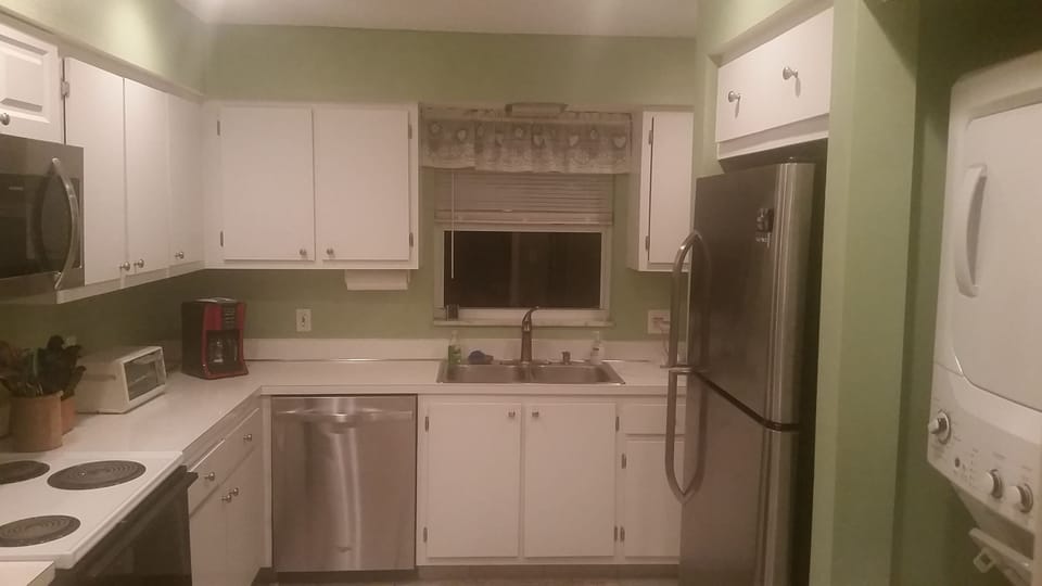 Stack washer & dryer/new refrigerator/toaster oven & dishwasher.