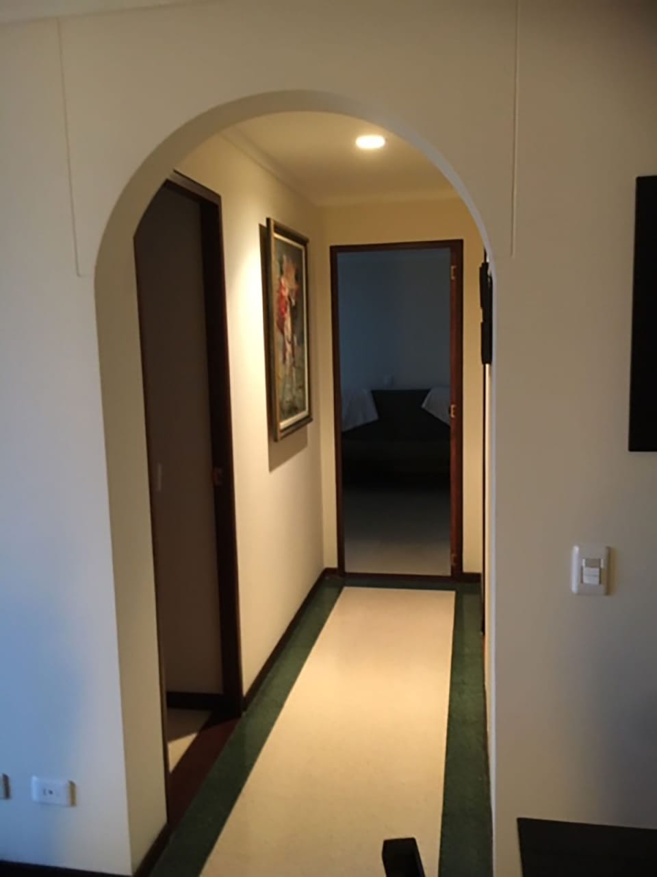 Hallway to the rooms and bathrooms