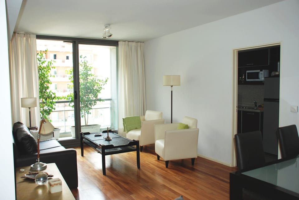 Spacious living and dining room with wooden floor
