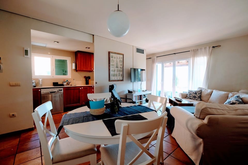 Living area with kitchen beyond