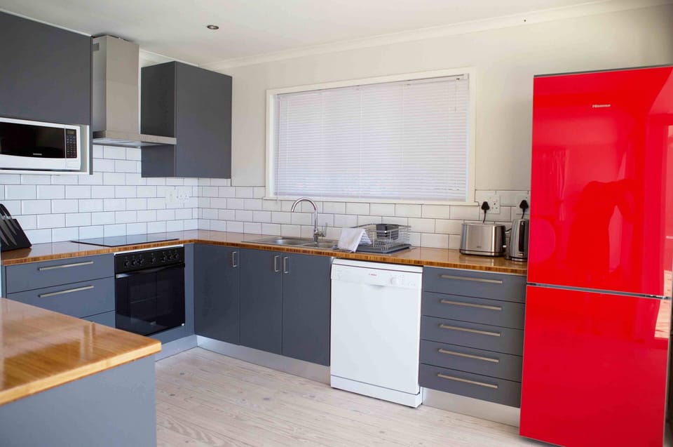 Well-equipped kitchen with large fridge/freezer, dish washer and microwave