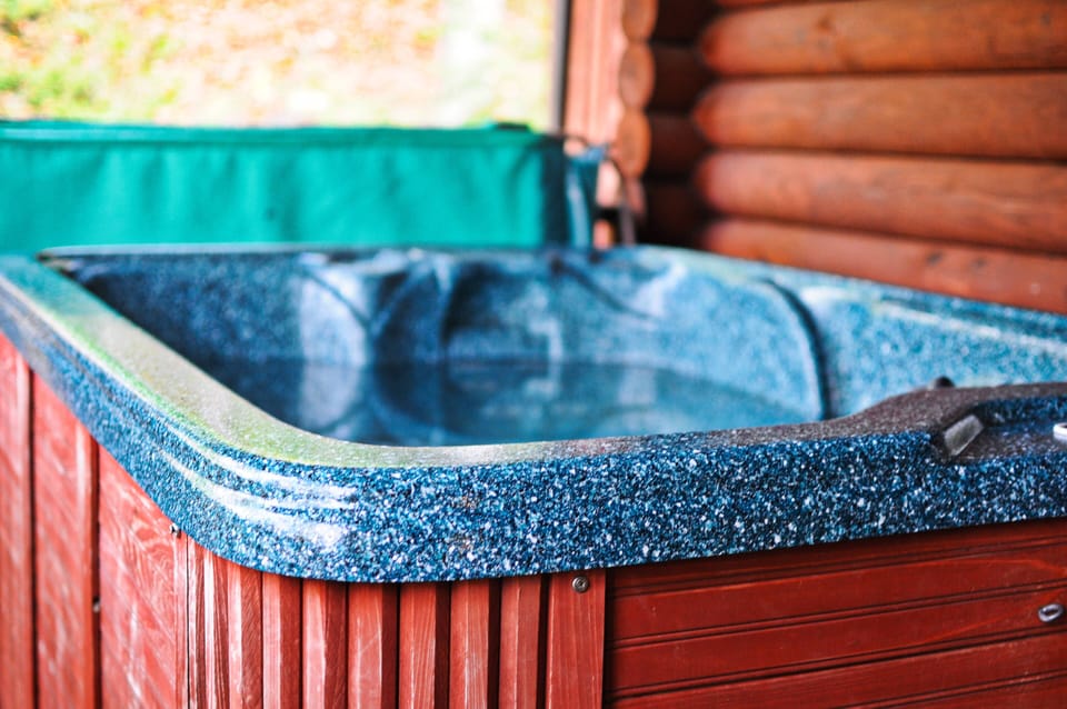 Private Hot Tub on the deck overlooking the property.