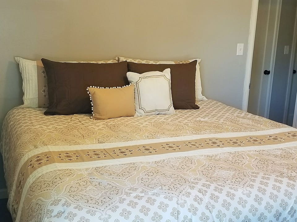 Bedroom #1 with king bed and dresser