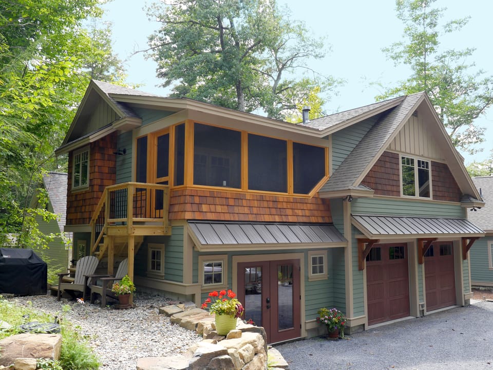 Exterior view. Bedroom and screen porch upstairs. Patio, gas grill and seating