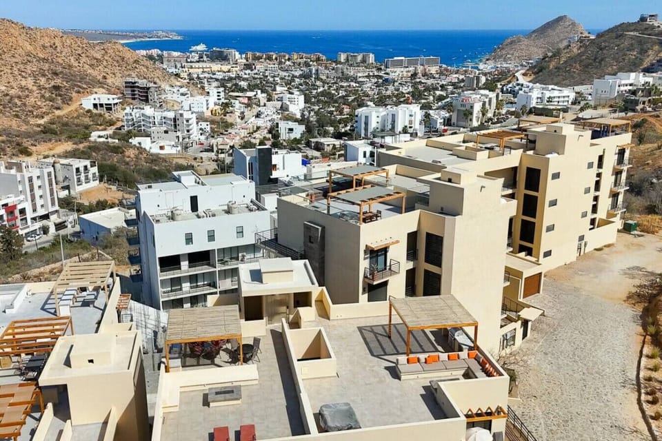 Stunning rooftop views overlooking the lively surrounding neighborhood and hills.