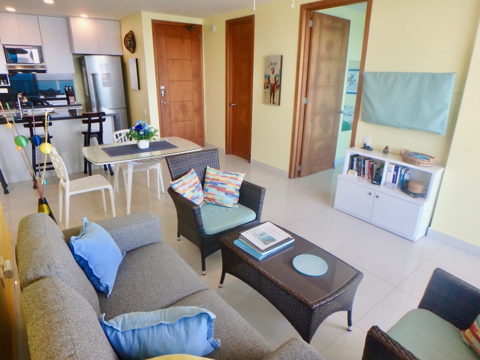 Living/dining area; open door to king/twin bedroom