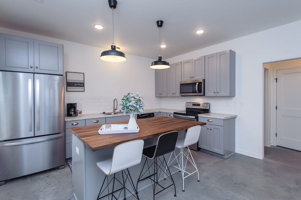 Large kitchen with brand new stainless steel appliances. 
