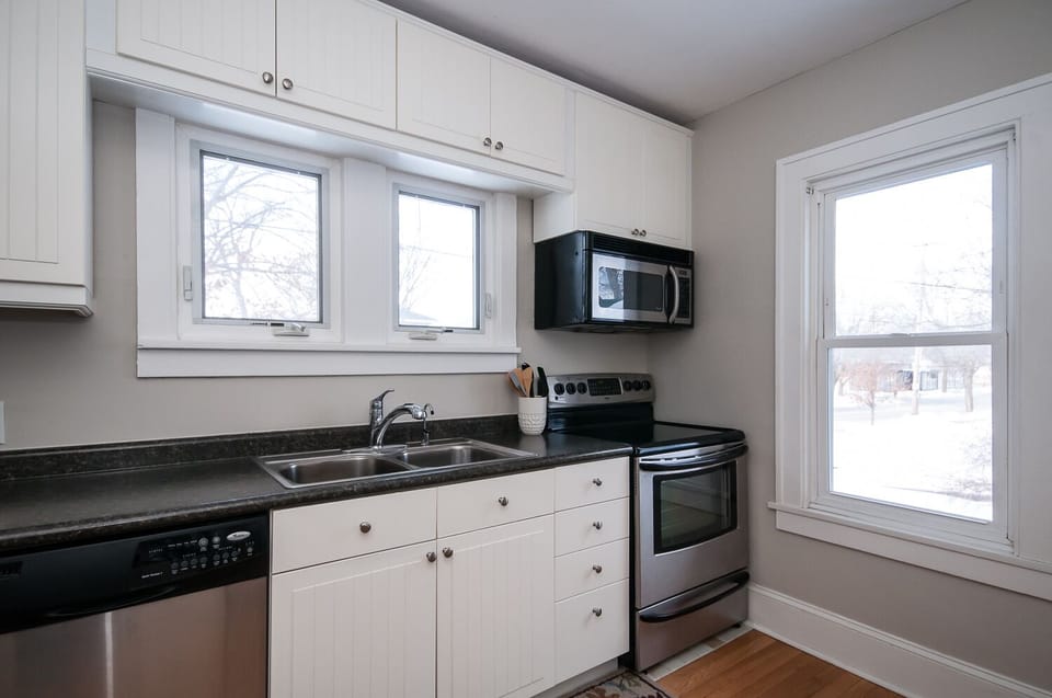 Main floor: Kitchen is fully stocked with pots and pans, spices, coffee maker, a