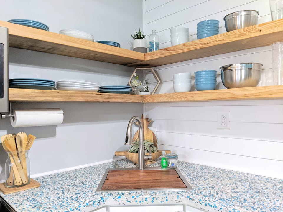 Plenty of dishware for four guests - Sink includes custom strainer+cutting board