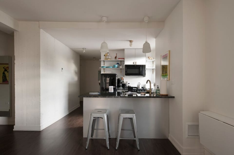 Fully stocked kitchen with bar seating