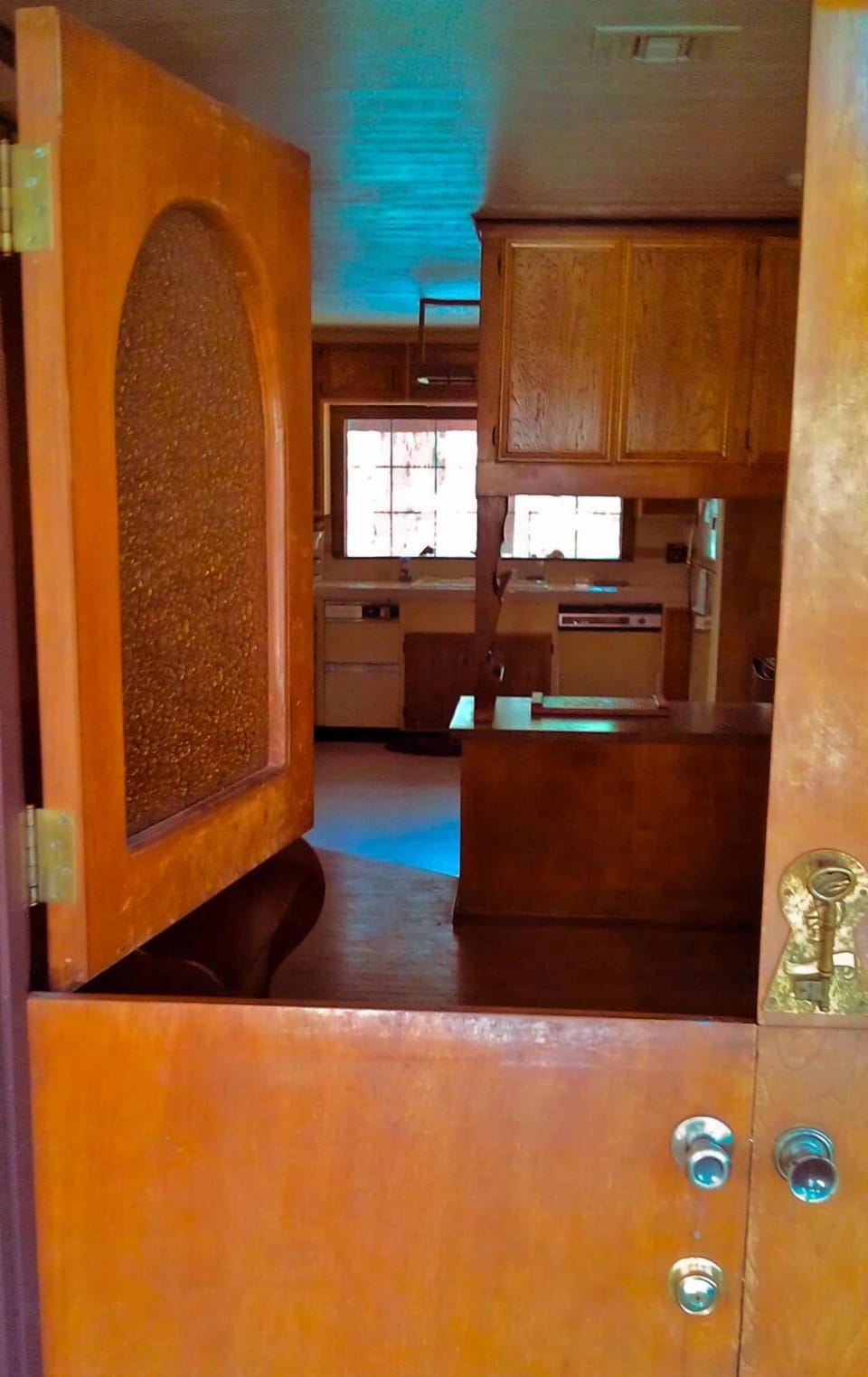 The Chalet is full of custom woodwork, such as the old-fashioned front doors...