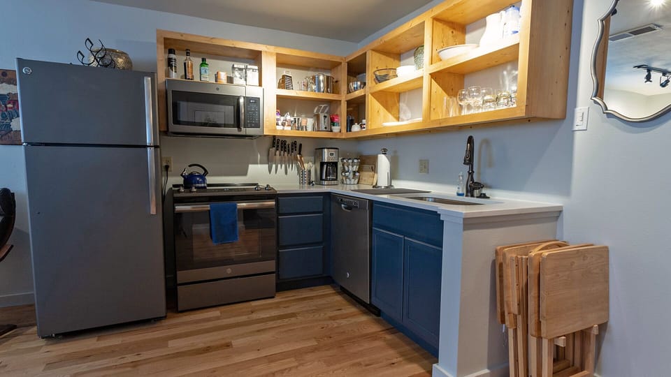 Well stocked kitchen with stainless appliances