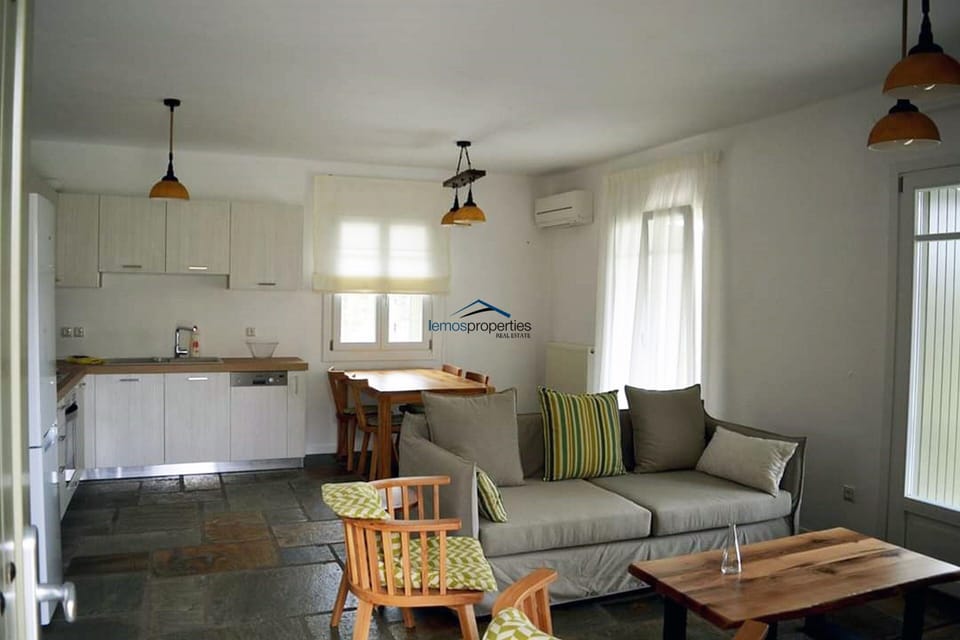 The living room, kitchen and dining area