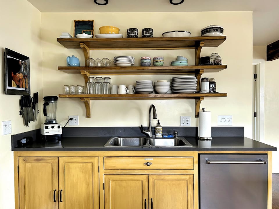 Plenty of dishes, coffee, and blender for you!