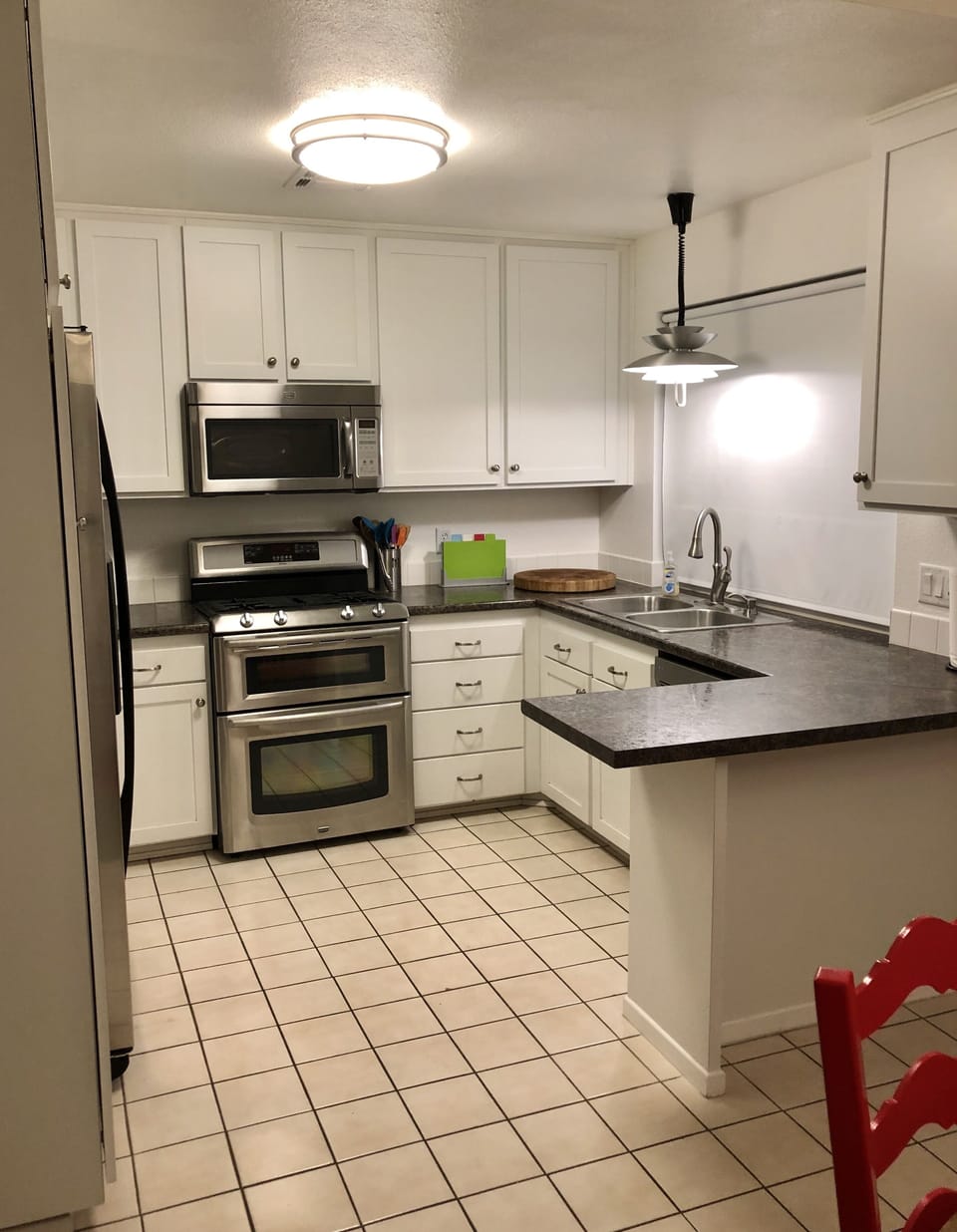 Stainless steel appliances in a fully stocked kitchen feel like home