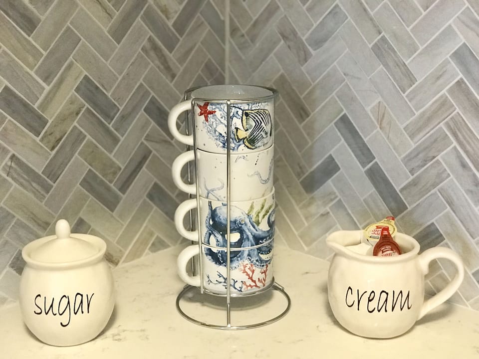 Fancy coffee mugs, creamer and sugar