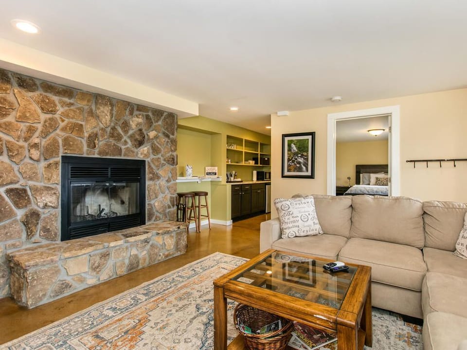 Access to the kitchenette, bathroom and one bedroom are off living/den area.