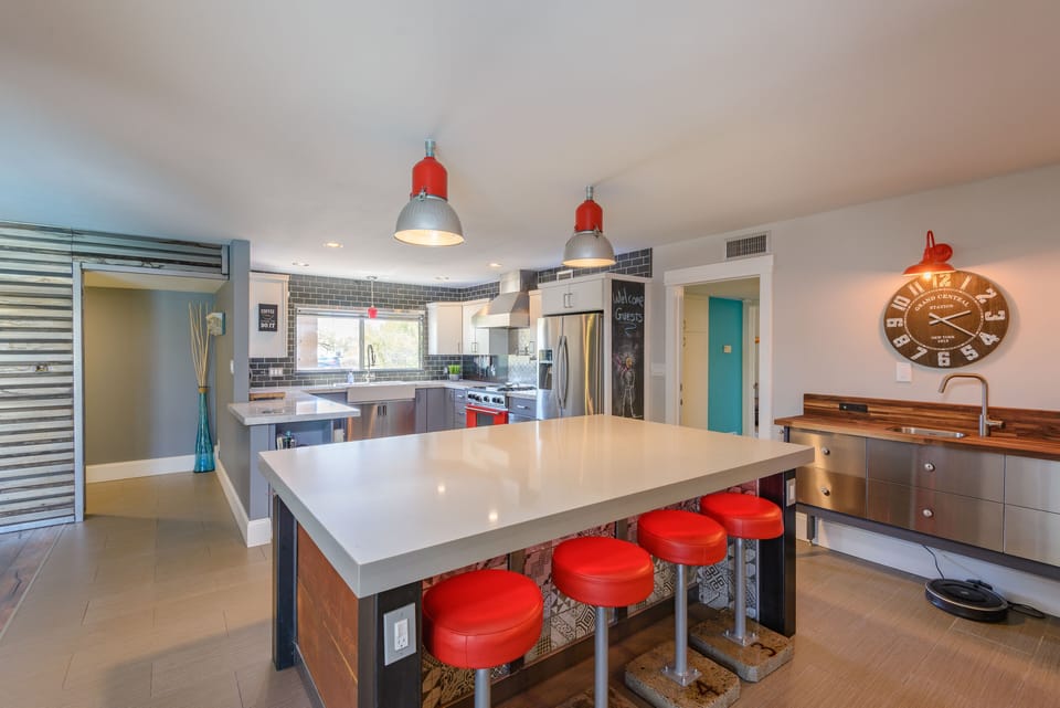 Massive kitchen island to gather at with stools for additional dinner seating