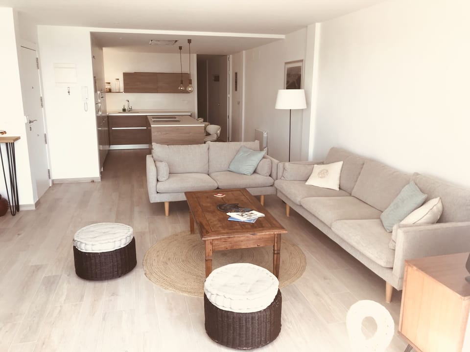 Living room with kitchen on background 