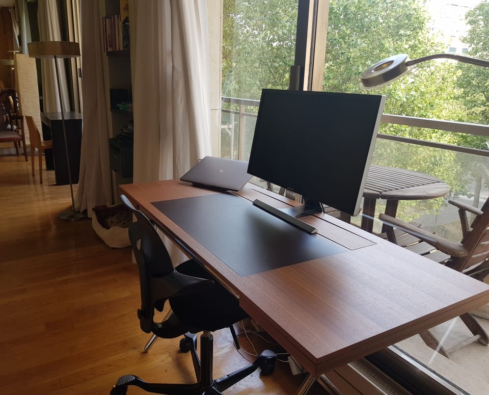 New Italian design office desk with ergonomic capisco pulls chair facing terrace