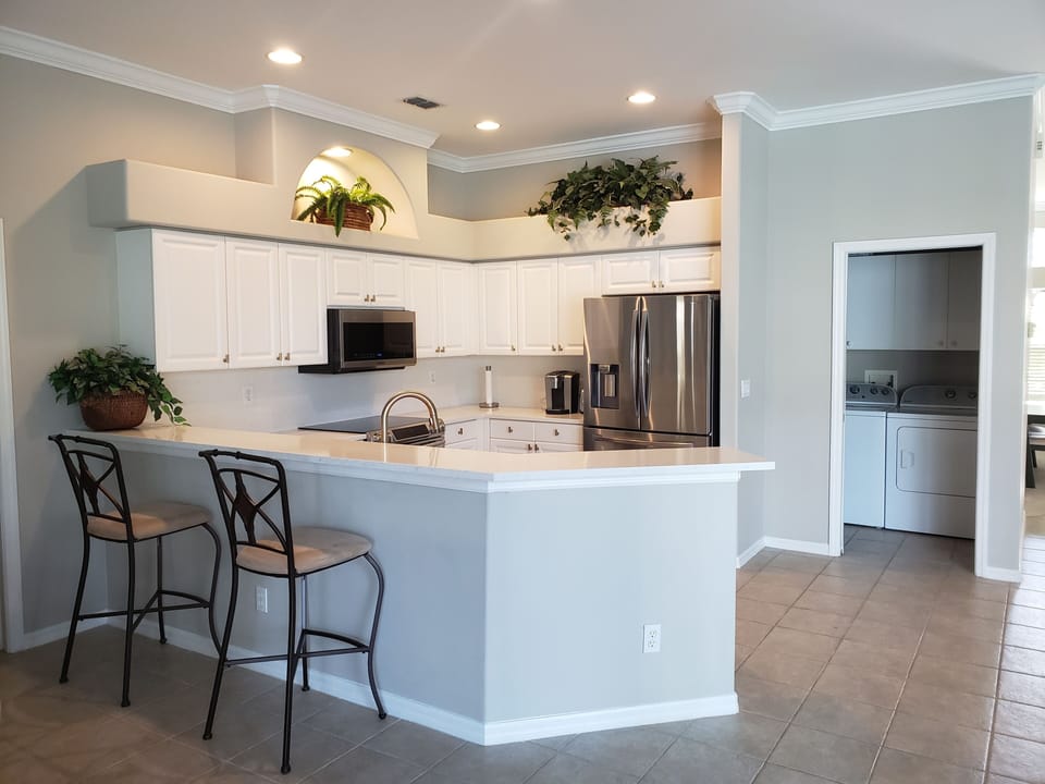 Newly renovated kitchen with quartz counters and new stainless steel appliances